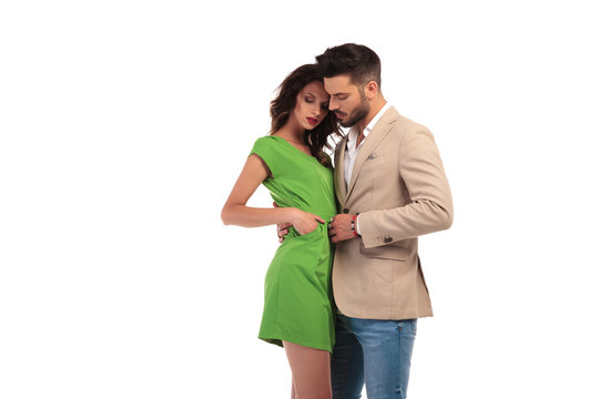 sexy young couple standing embraced