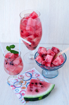Dessert and water with watermelon on the table