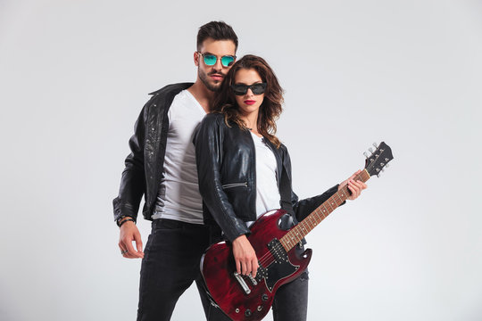 cool rock and roll couple with electric guitar