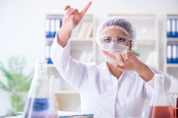 Female scientist researcher conducting an experiment in a labora