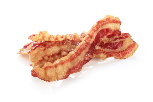 Cooked bacon rashers isolated on white background