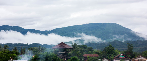 view of mountain with clouds in Vang Vieng, Laos