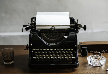 Closeup of retro vintage typewriter on wooden table