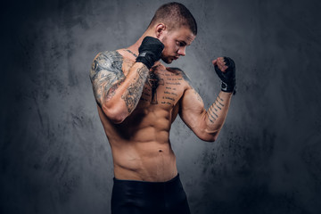 Fighter male over grey vignette background.