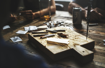 Marijuana is on a wooden cutting board