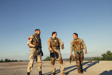 Rangers celebrating success, clapping with hands. Team work conceptual image.
