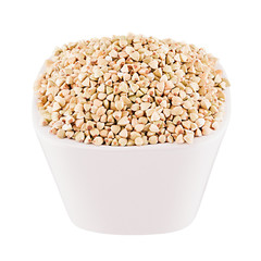 Green buckwheat in white bowl, closeup, isolated. Template for menu, cover, advertising.