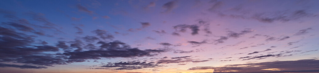 Colorful sunset sky with clouds in twilight time