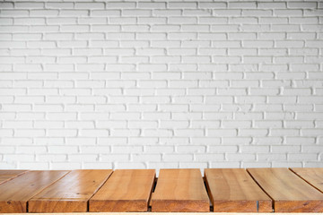 Empty top of natural wooden table and retro white brick wall background. For product display