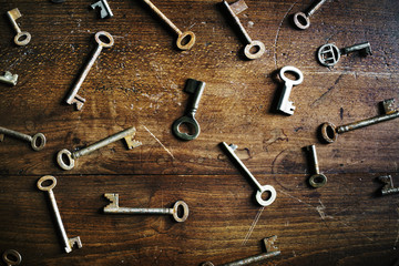 A key is isolated on wooden table
