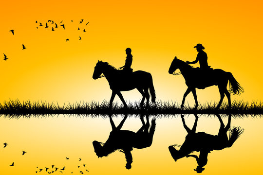 Two riders on horses standing together on sunset