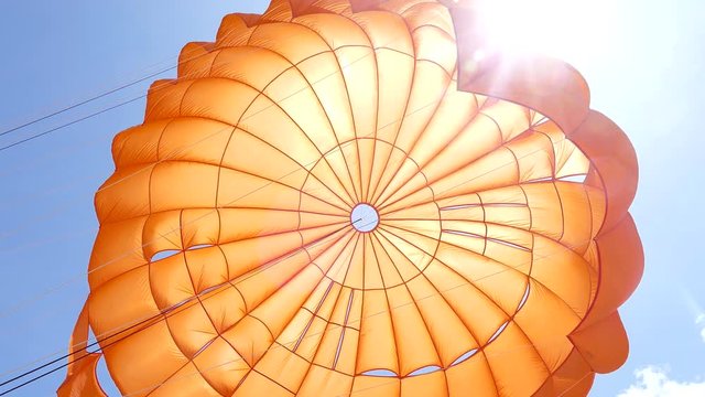 orange Parasailing on the air
