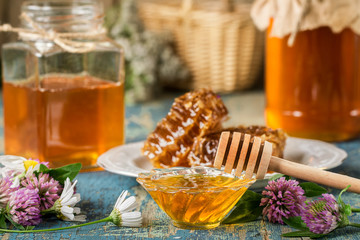 natural organic honey  on rustic  table