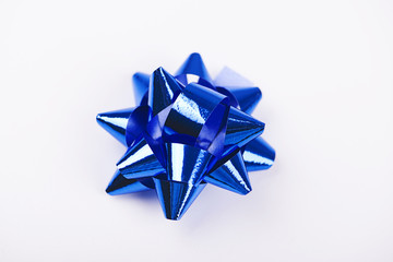 Bow with star shape of blue  color decoration paper on white background