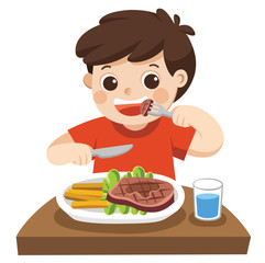 A cute boy is eating steak with vegetables for a lunch.