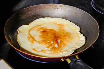 a pancake fried in a skillet