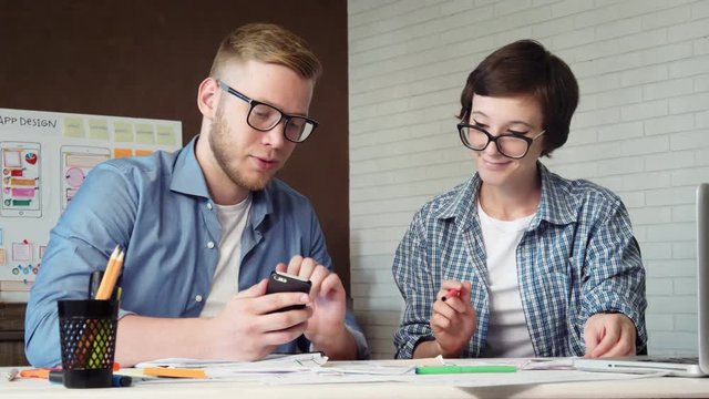 UX designers discuss their app prototype