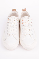 Pair of new white sneakers, isolated on white background