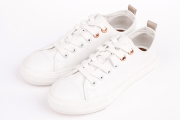 Pair of new white sneakers, isolated on white background