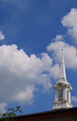 Blue sky clouds and white spiers