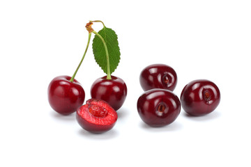 cherry with green leaf isolated on white background