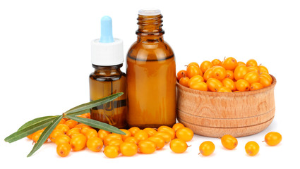 Sea buckthorn with bottle with sea buckthorn oil isolated on white background