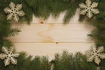 Christmas background. Top view with copy space. fir tree on light wooden background