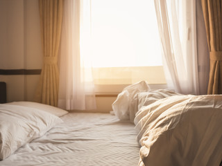 Bed Pillows Mattress Hotel unmade Bedroom window morning sunlight