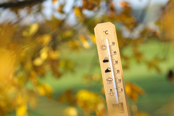 Naklejka na ściany i meble nice weather in the autumn shown with mercury thermometer