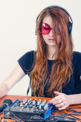 Girl behind the music console © skilas