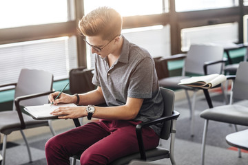 Student Taking a Note