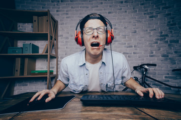 Young man playing game at home and streaming playthrough or walk