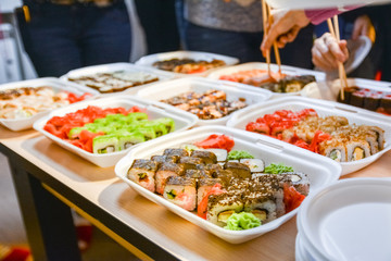 sushi rolls in white plates
