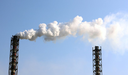 Smoke emission from factory pipes / Factory pipe polluting air / Environmental pollution /...