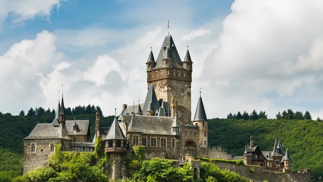 Summer timelapse sequence of the Reichsburg Cochem in the Moselle Valley in Germany with fast moving clouds in the background in 4K resoultion.