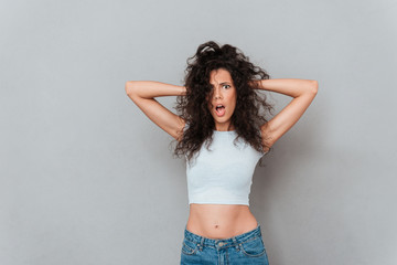 Fototapeta premium Angry displeased woman looking camera with opened mouth