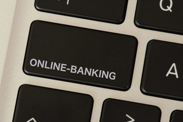 Ein Computer und eine Taste für Online Banking