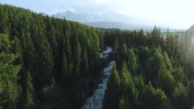 Aerial photo of river that flow from waterfall 4k slow motion aerial shot