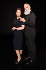 man touching woman on shoulder