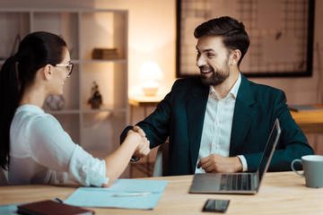 Positive delighted colleagues taking agreement