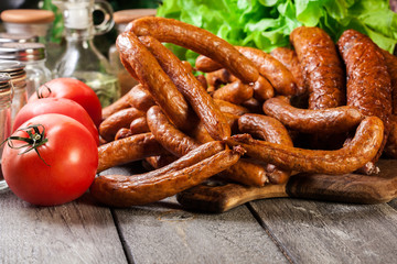 Assorted smoked sausages on a cutting board