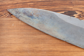 Japanese santoku knive on wooden board