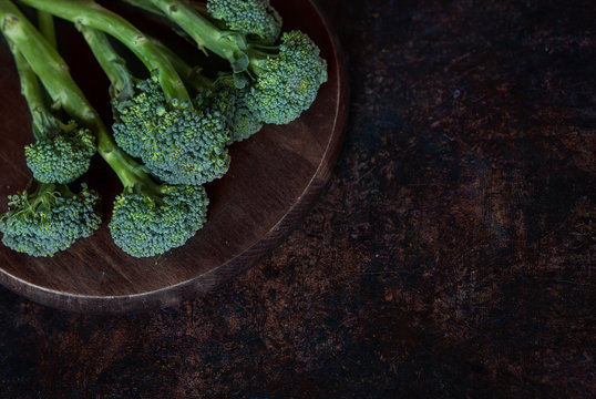 Fresh green broccolini on a board