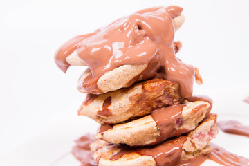 Pancakes with apples covered with chocolate