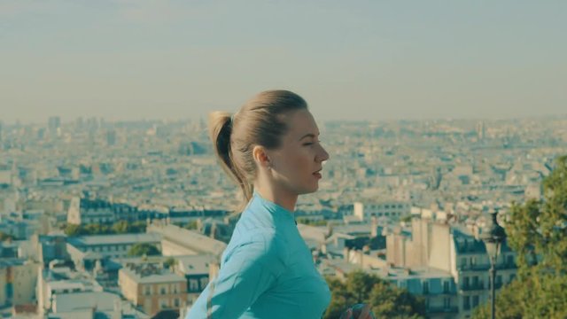 Woman running. Morning runner on the street with beautiful city view in Paris under sunlight.