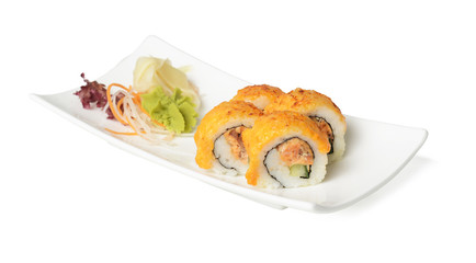 Plate of sushi rolls with salad