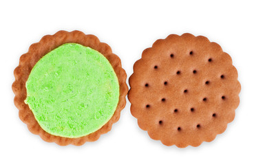 opened mint creme sandwich cookie in front of several cookies isolated on a white background.