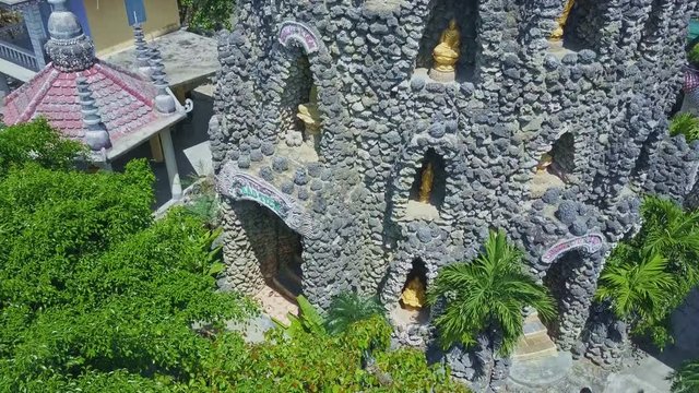 Flycam Shows Golden Statues in Buddhist Temple Tower Bays