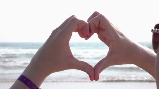 High quality video of heart symbol by the ocean in real 1080p slow motion 250fps