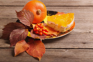 pumpkin pie on wooden table